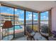 Relaxing lanai with comfortable seating and stunning views of the pool and waterfront at 19701 Gulf Blvd # 231, Indian Shores, FL 33785