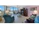 Cozy living room with plush seating, tile floors, and a spectacular view of the water at 19701 Gulf Blvd # 231, Indian Shores, FL 33785