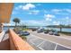 Tranquil view of the parking area and boat docks with a picturesque waterfront backdrop at 19701 Gulf Blvd # 231, Indian Shores, FL 33785