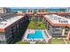 Relaxing community pool area surrounded by lush landscaping and comfortable lounge chairs at 19701 Gulf Blvd # 231, Indian Shores, FL 33785
