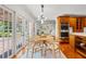 Eat-in dining with wood table, stylish chairs, and abundant natural light at 20315 Mid Ct, Lutz, FL 33558