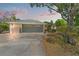 Charming single-story home featuring a two car garage, well-kept lawn, and mature trees at 20315 Mid Ct, Lutz, FL 33558