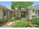 Inviting entryway with well-maintained landscaping leading to an elegant front door at 20315 Mid Ct, Lutz, FL 33558