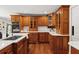 Spacious kitchen with custom wood cabinets, stainless steel appliances, and ample counter space at 20315 Mid Ct, Lutz, FL 33558