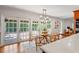 Breakfast nook with doors to outdoor patio, adjacent to well-appointed kitchen at 20315 Mid Ct, Lutz, FL 33558