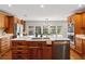 Beautiful kitchen featuring wood cabinets, a large island, and stainless steel appliances at 20315 Mid Ct, Lutz, FL 33558