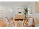 Cozy living room featuring hardwood floors, modern decor, a stylish cabinet, and a house plant at 20315 Mid Ct, Lutz, FL 33558