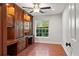 Charming home office with custom cabinets, hardwood floors, and natural light at 20315 Mid Ct, Lutz, FL 33558