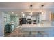 Bright kitchen featuring white cabinets, quartz countertops, and stainless appliances at 22 Oak Ave, Palm Harbor, FL 34684