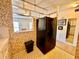 A quaint eat-in kitchen featuring a black refrigerator and view into the condo's living area at 2370 Jamaican St # 46, Clearwater, FL 33763
