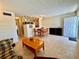 A comfortable living area with open access to the kitchen and dining area; tiled flooring throughout at 2370 Jamaican St # 46, Clearwater, FL 33763