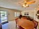 Cozy living area with tile flooring, a ceiling fan, and plenty of natural light at 2370 Jamaican St # 46, Clearwater, FL 33763
