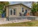 Cozy outdoor patio features dining set under an umbrella, perfect for enjoying alfresco meals at 2460 16Th N Ave, St Petersburg, FL 33713