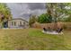 Expansive backyard with a fire pit area, patio dining and privacy fencing offers a tranquil outdoor retreat at 2460 16Th N Ave, St Petersburg, FL 33713