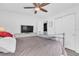 Neutral bedroom with a TV, closet, and neutral colored walls at 2460 16Th N Ave, St Petersburg, FL 33713