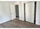 Bedroom featuring closet and durable wood-look flooring with neutral paint throughout at 2460 16Th N Ave, St Petersburg, FL 33713