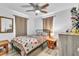 This bedroom has natural light, simple decorations, and a ceiling fan at 2460 16Th N Ave, St Petersburg, FL 33713