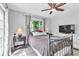 Inviting bedroom with a plush bed, ceiling fan, and ample natural light for relaxation at 2460 16Th N Ave, St Petersburg, FL 33713