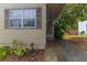 Inviting front entrance featuring a covered entry, a gray door, and stylish exterior finishes at 2460 16Th N Ave, St Petersburg, FL 33713