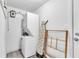 Functional laundry room with stacked washer and dryer, plus additional storage space at 2460 16Th N Ave, St Petersburg, FL 33713