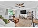 Bright and airy living room with hardwood floors, comfortable seating, and modern decor at 2460 16Th N Ave, St Petersburg, FL 33713
