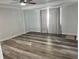 Bright living room with wood-look flooring, neutral walls, and a ceiling fan for added comfort at 2460 16Th N Ave, St Petersburg, FL 33713