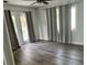 Bright living area with French doors to the outside and stylish wood-look flooring at 2460 16Th N Ave, St Petersburg, FL 33713