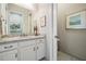 Bright bathroom with a double-sink vanity, granite countertops, and ample storage space at 2468 Coco Palm Cir, Wesley Chapel, FL 33543