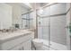 Updated bathroom featuring a glass-enclosed shower, granite countertop and modern fixtures at 2468 Coco Palm Cir, Wesley Chapel, FL 33543