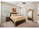Inviting bedroom boasts a queen-sized bed, large mirror, neutral colors and natural light at 2468 Coco Palm Cir, Wesley Chapel, FL 33543