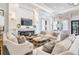 A spacious clubhouse living area features plush seating, fireplace, and entertainment center for comfortable gatherings at 2468 Coco Palm Cir, Wesley Chapel, FL 33543