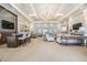 A large, well-appointed clubhouse features plenty of seating and a wet bar for entertaining guests at 2468 Coco Palm Cir, Wesley Chapel, FL 33543