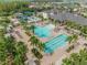 Overhead view of the community pool area, complete with a splash pad and lounge chairs at 2468 Coco Palm Cir, Wesley Chapel, FL 33543