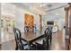 Open-concept dining area showcases elegant lighting and an inviting atmosphere for gatherings at 2468 Coco Palm Cir, Wesley Chapel, FL 33543