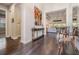 Inviting home foyer featuring hardwood floors, high ceilings, a console table, and views into the living room at 2468 Coco Palm Cir, Wesley Chapel, FL 33543