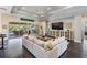 Bright living room boasts a decorative fireplace, built-in storage, and access to the outdoor patio at 2468 Coco Palm Cir, Wesley Chapel, FL 33543