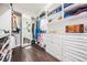 Spacious walk-in closet features custom shelves, drawers, and a full length mirror at 2468 Coco Palm Cir, Wesley Chapel, FL 33543