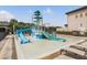 A fun water park features slides and a splash area for and families to enjoy on a sunny day at 2468 Coco Palm Cir, Wesley Chapel, FL 33543