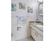 Well-lit bathroom with granite countertop and coastal decor at 2700 Bayshore Blvd # 4204, Dunedin, FL 34698