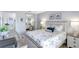 Stylish bedroom with a mirrored closet, side tables, and decorative accents at 2700 Bayshore Blvd # 4204, Dunedin, FL 34698