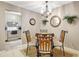 Charming dining area with views into kitchen; features round table and four chairs at 2700 Bayshore Blvd # 4204, Dunedin, FL 34698