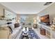 Cozy living room featuring a comfortable sofa, a large window, and a decorative rug at 2700 Bayshore Blvd # 4204, Dunedin, FL 34698