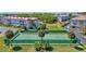 Aerial view of the community tennis court with lush green surroundings at 2700 Bayshore Blvd # 4204, Dunedin, FL 34698