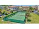Aerial view of the community tennis court with lush green surroundings at 2700 Bayshore Blvd # 4204, Dunedin, FL 34698