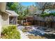 The backyard has a luxurious hot tub with bar seating and a tiki table perfect for relaxation at 275 S Highland Ave, Tarpon Springs, FL 34689