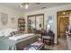 This bedroom showcases stylish decor, a vanity with a mirror, and lots of natural light at 275 S Highland Ave, Tarpon Springs, FL 34689