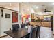 Open dining area leads to kitchen, showcasing tile floors and bright interior at 275 S Highland Ave, Tarpon Springs, FL 34689