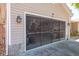 Two car garage has a screen door system, offering ventilation and pest control at 275 S Highland Ave, Tarpon Springs, FL 34689