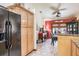 View from the kitchen to the breakfast nook; featuring tile floors and warm interior at 275 S Highland Ave, Tarpon Springs, FL 34689