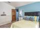 Bedroom with tile floors, aqua walls, and natural light coming in through the window at 275 S Highland Ave, Tarpon Springs, FL 34689
